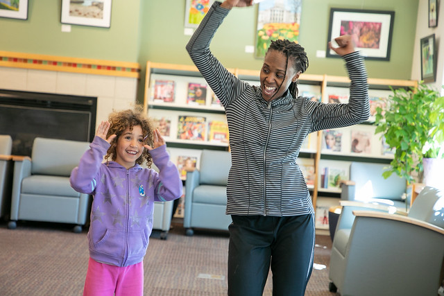 Patrons dancing in the library