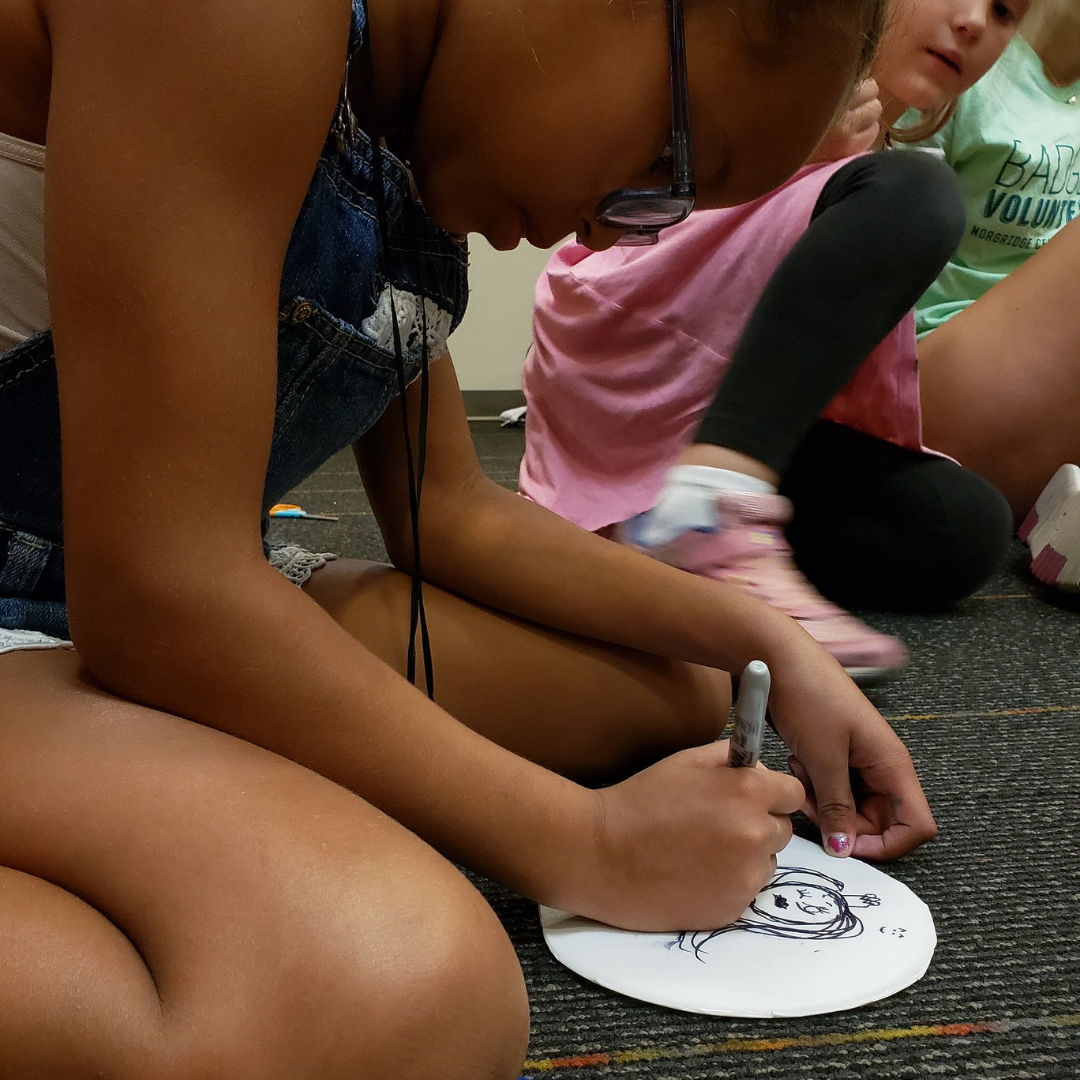 Child creates a foam block print