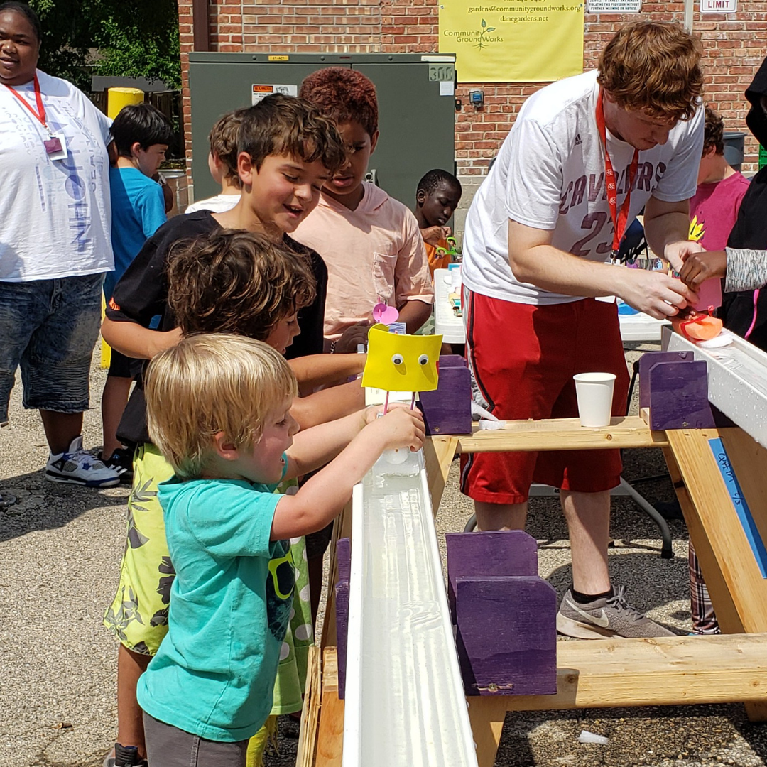 Kids launch their boats during the Bubbler Regatta