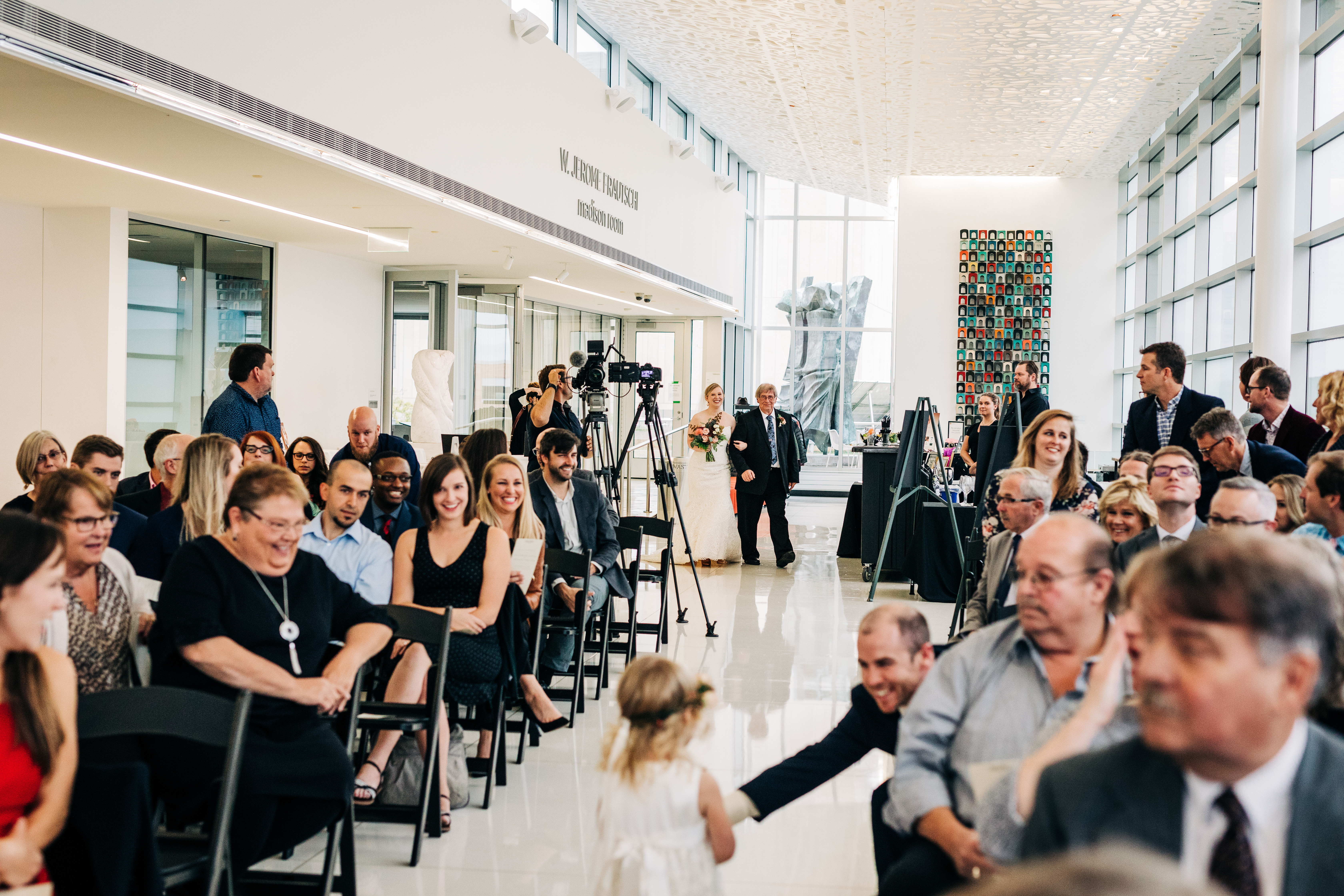 guests waiting for bride to walk down wedding aisle