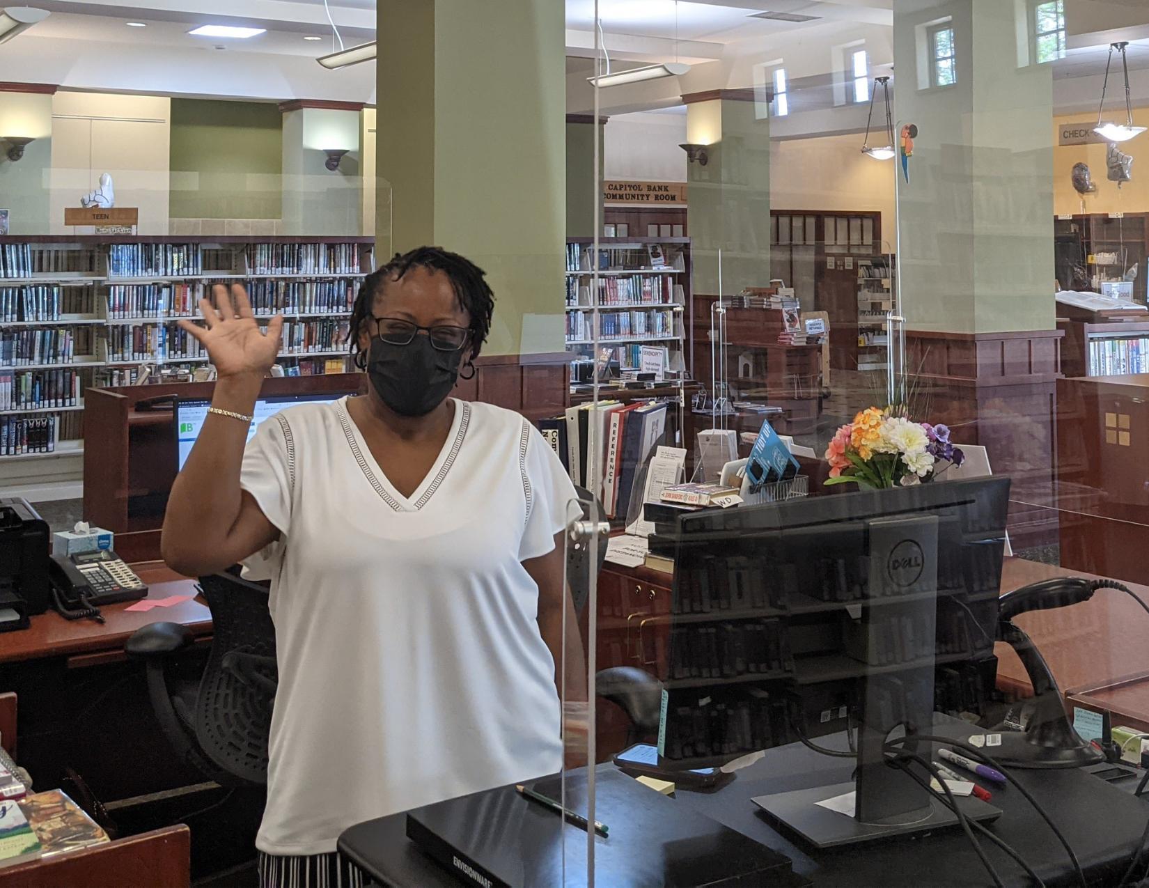 Librarian Kim at the service desk at Alicia Ashman